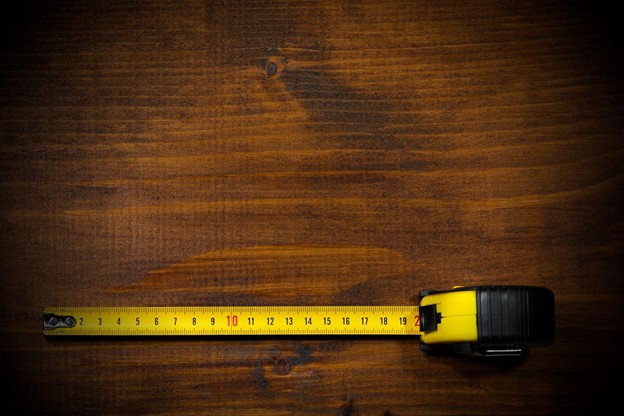 Measuring tape on wooden table